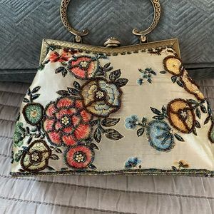 Vintage hand beaded convertible satin handbag.